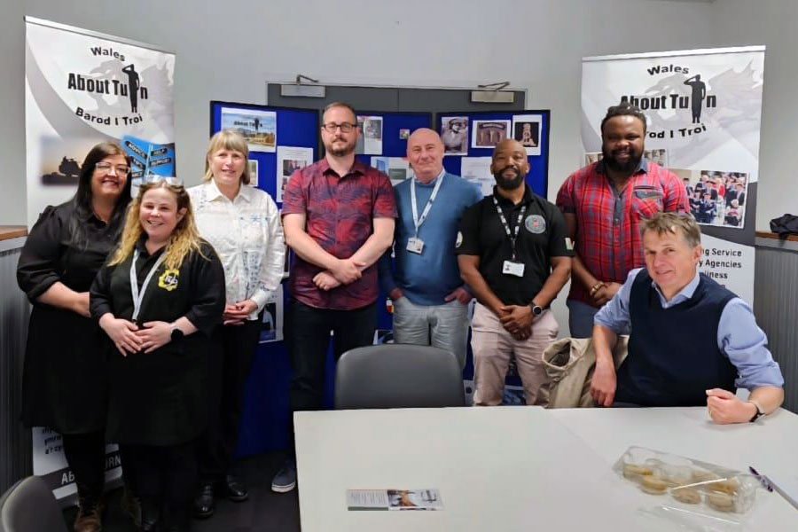 Group photo of veterans and staff from About Turn Wales providing peer mentoring and support at a drop-in.