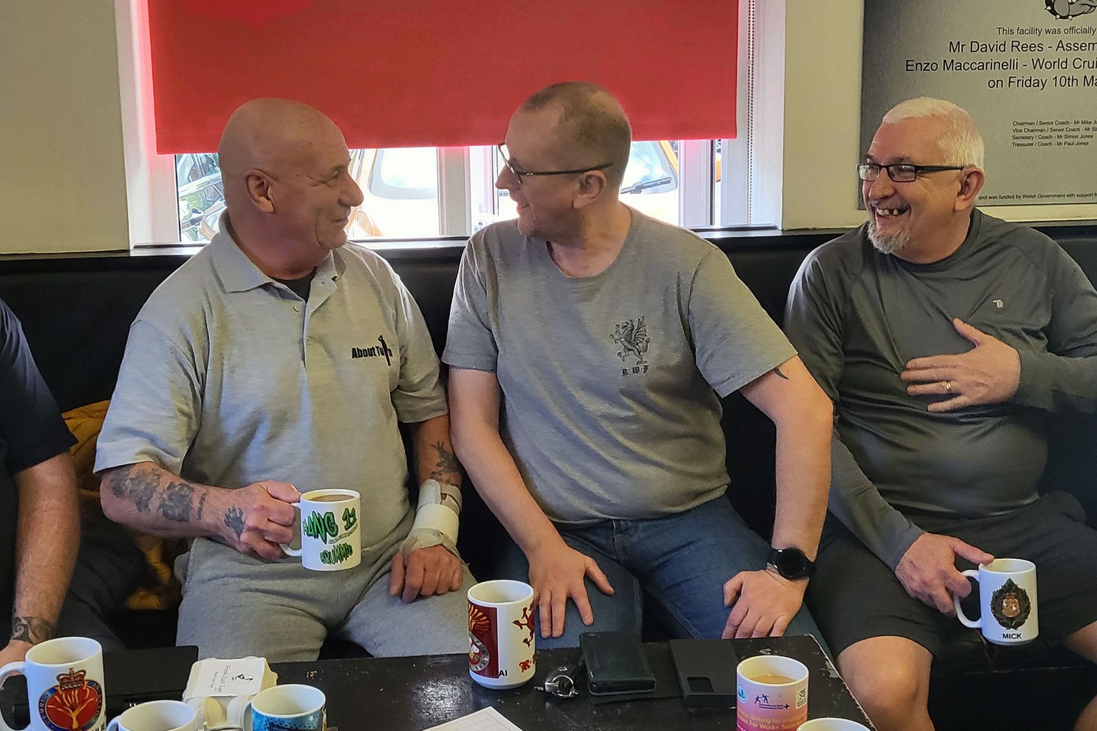 Group photo of veterans and staff from About Turn Wales providing peer mentoring and support.